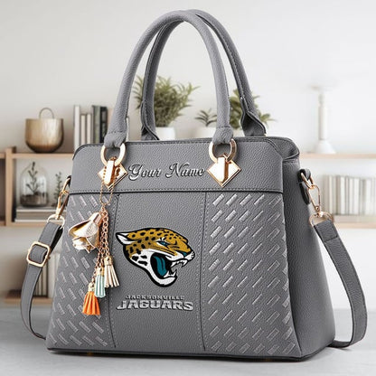 LIMITED EDITION - NEW CUSTOMIZED NFL30 JSJ JACKSONVILLE JAGUARS LUXURY HANDBAG IN MULTIPLE COLORS